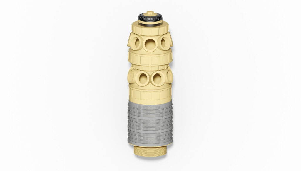 Filterdüse mit gelbem Gehäuse und grauem unteren Abschnitt, ausgestattet mit mehreren Anschlüssen.