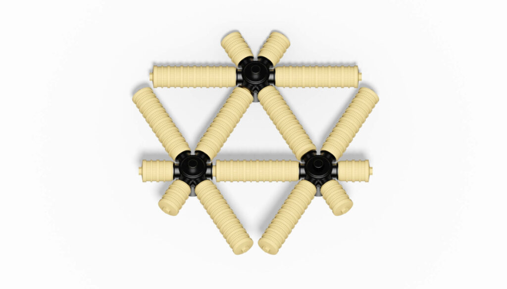 Anordnung von Filterdüsen aus Kunststoff mit schwarzem Verbindungselement in einem geometrischen Muster.